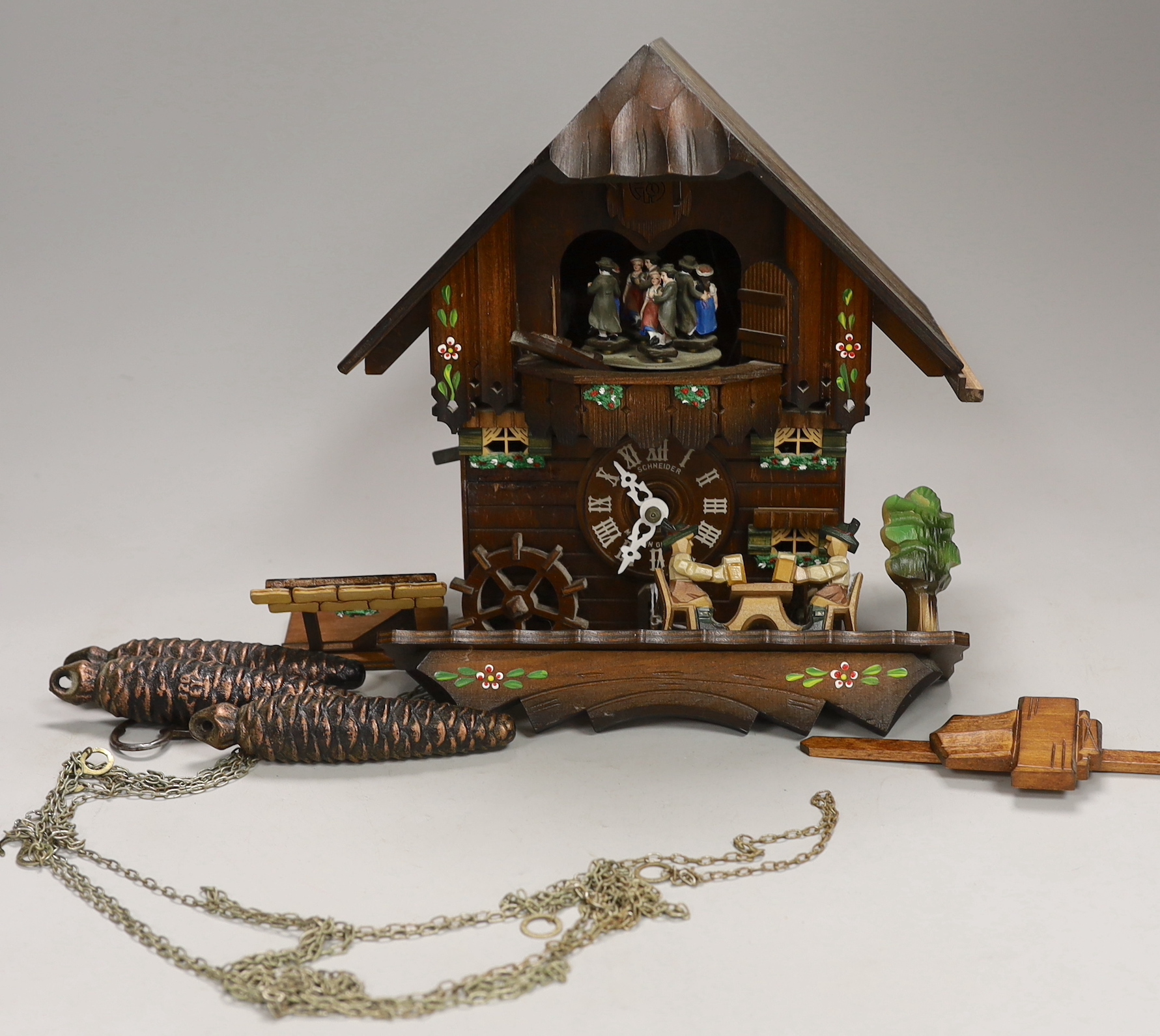 A Schneider German carved wood cuckoo clock